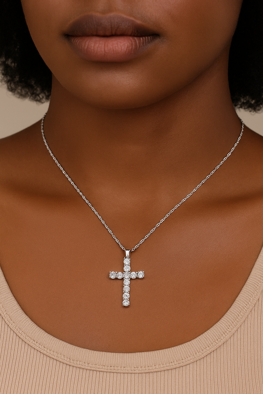 Close-up of a Black woman wearing a 14K white gold moissanite cross necklace from Symi Jewel, showcasing its radiant sparkle and elegant silhouette.

moissanite cross necklace, luxury faith jewelry, 14k gold cross pendant, Symi Jewel moissanite, white gold moissanite necklace, gifts for her, elegant religious jewelry, ethical diamond alternative, faith jewelry, fine jewelry under 200


