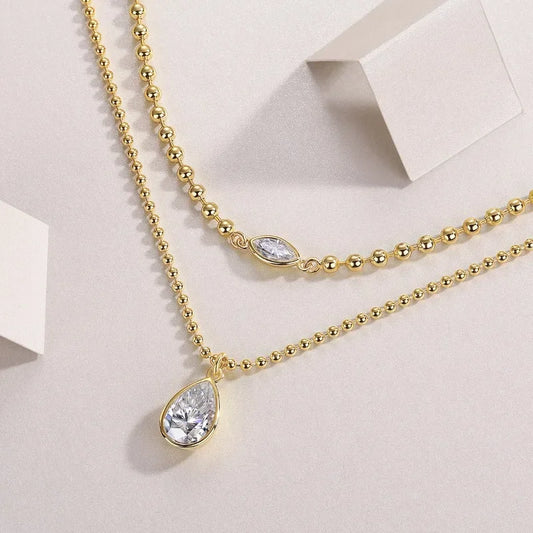 Moissanite pear pendant necklace

925 sterling silver layered necklace

VVS1 clarity Moissanite jewelry

Symi Jewel gold bead chain

18K white gold plated necklace

Minimal luxury necklace for women

Waterproof hypoallergenic Moissanite chain

Elegant Moissanite layering necklace